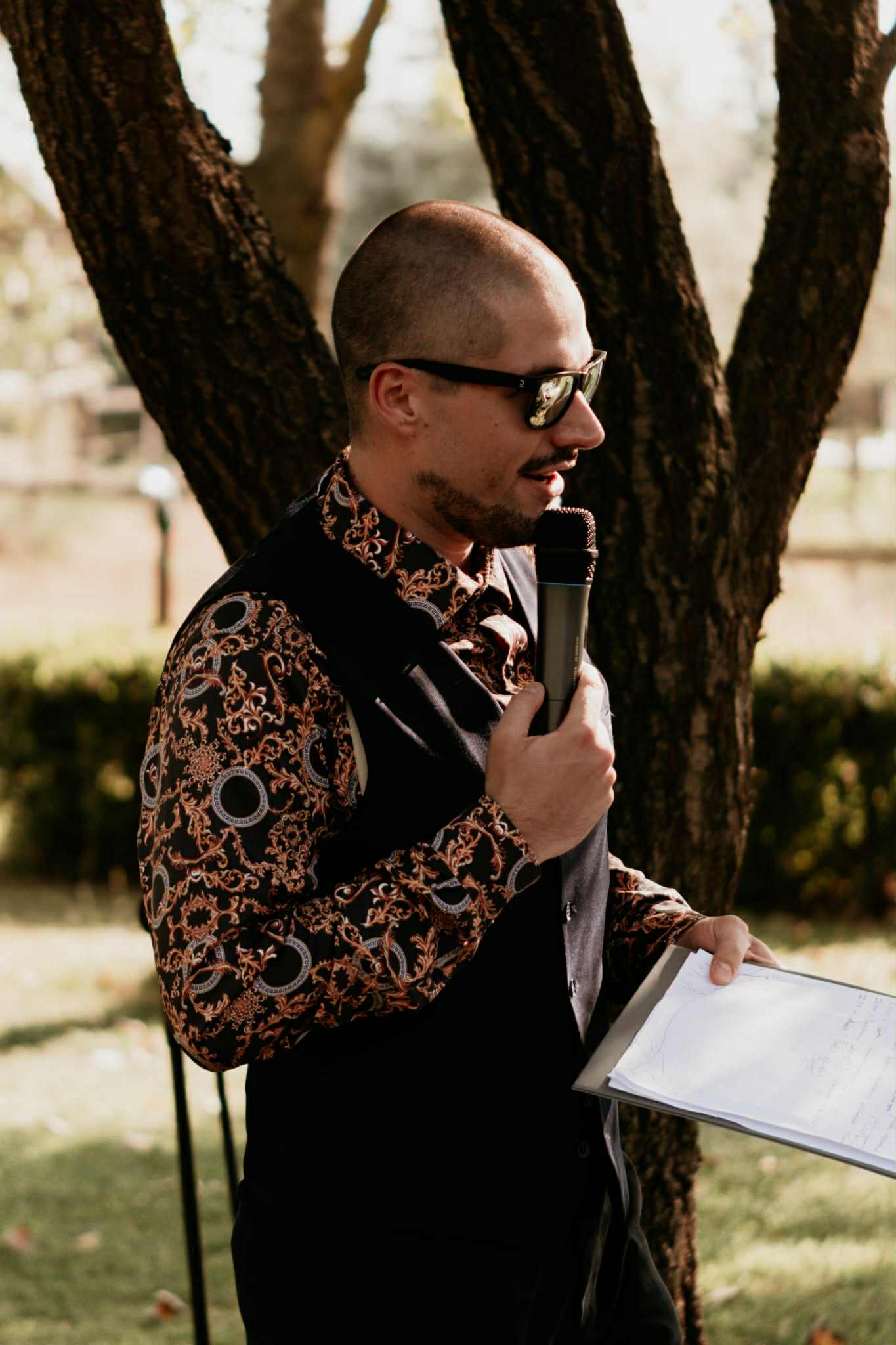 Dominik hosting with a microphone